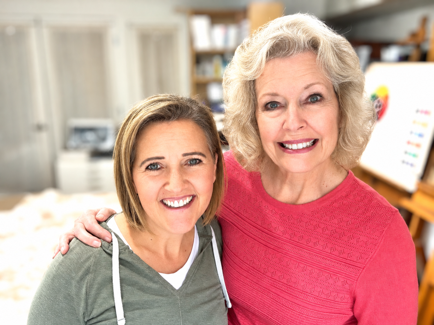 Camille Cornaby and Wendy Castleton smiling together in their art studio